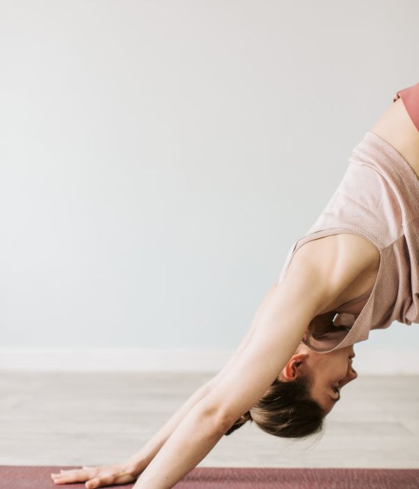 Woman in a serene yoga pose, embodying peace and balance.